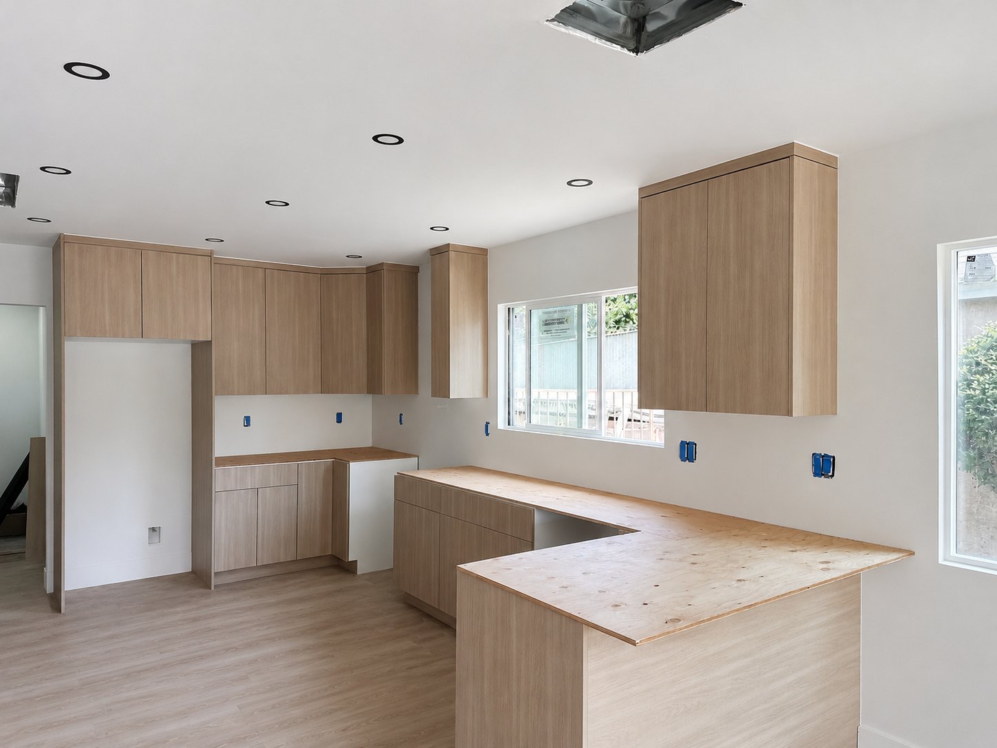 Natural oak kitchen cabinets and island millwork