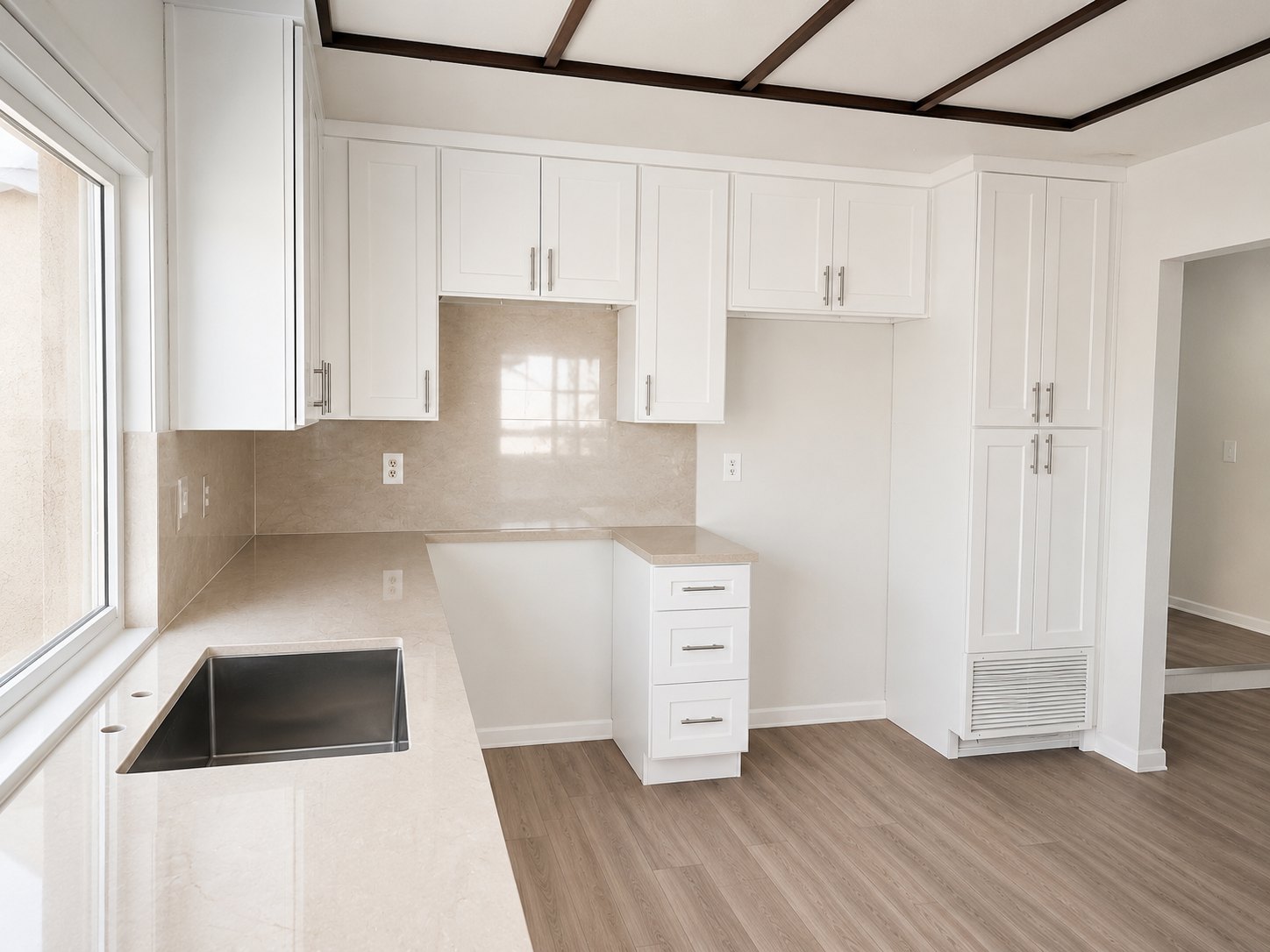 Completed white Shaker kitchen with quartz counters